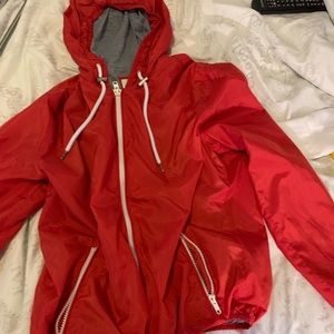 Red windbreaker.